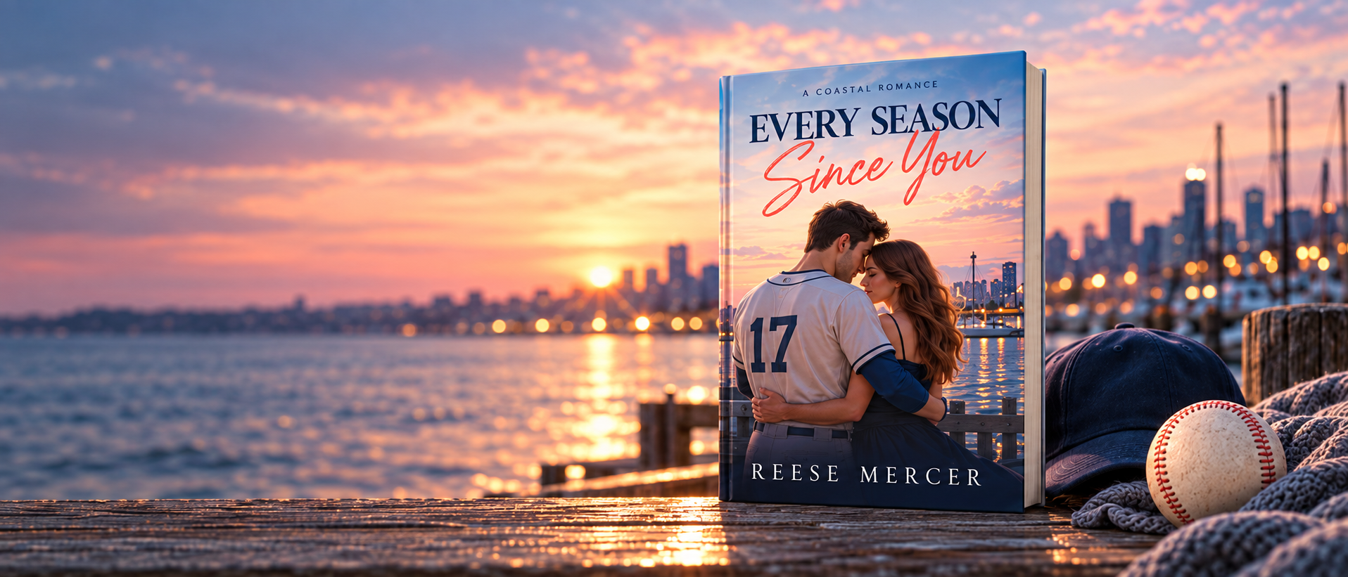 Every Season Since You book beside a baseball cap and ball on a waterfront at sunset
